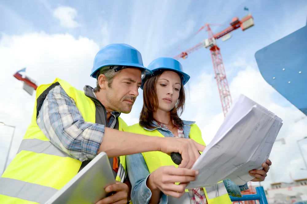 A pair of construction workers representing the planning of SANHA® on your construction site